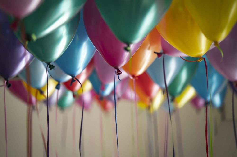 Colorful balloons with ribbons at a birthday celebration