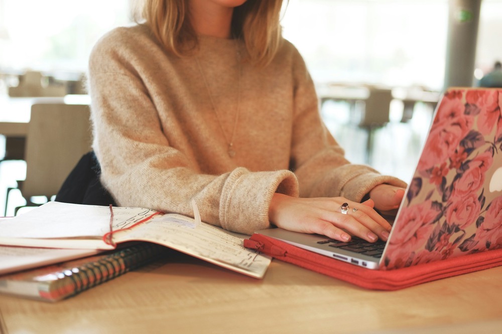 An event planner reviewing ideas with clients around a tablet
