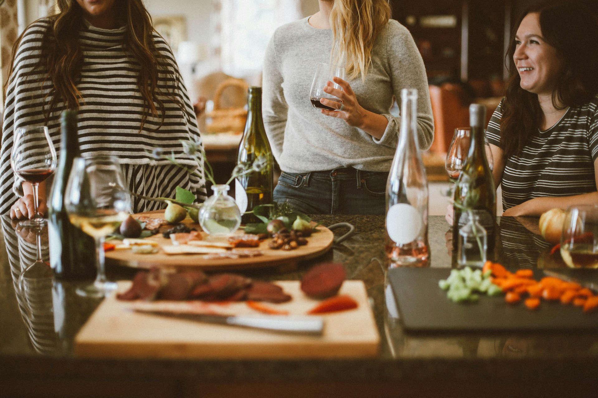 A group of friends having dinner and drinking wine together.